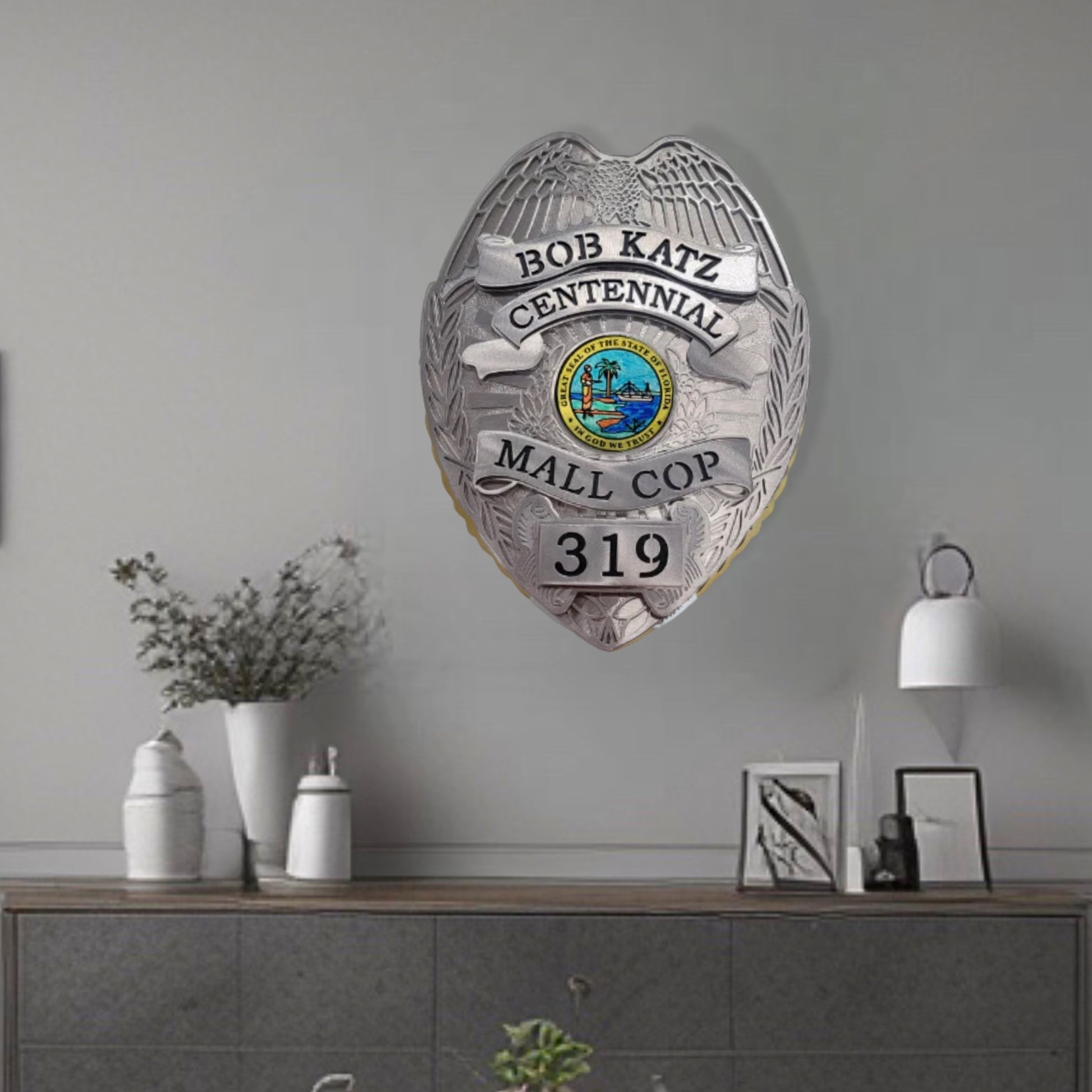 Wall Decor Of Centennial Mall Cop Badge
